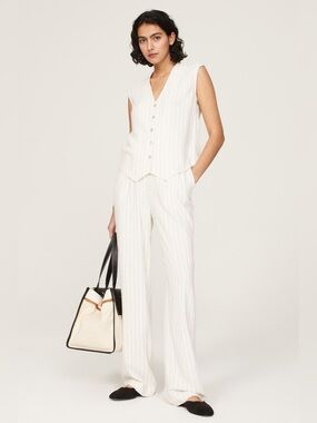 DONNI. Pleated pinstripe linen blend trousers